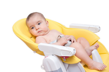 mother feeding her baby son with fruit puree