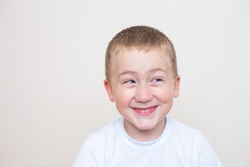 five year old boy with a funny facial expression