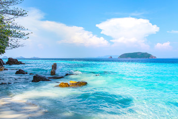 Beautiful beach and tropical sea with clear sky