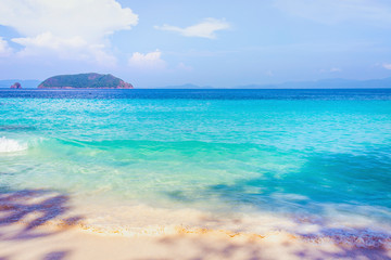 Beautiful beach and tropical sea with clear sky