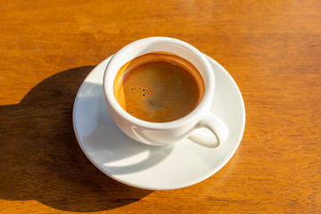 Espresso coffee hot golden morning sun.