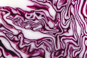 Obraz premium Red cabbage macro background. Texture of the cut cabbage