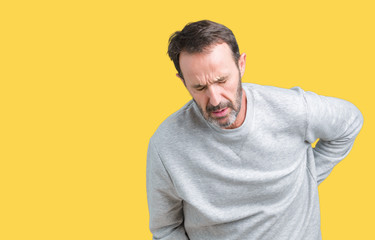 Handsome middle age senior man wearing a sweatshirt over isolated background Suffering of backache,...