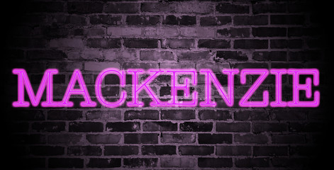 Fototapeta na wymiar first name Mackenzie in pink neon on brick wall