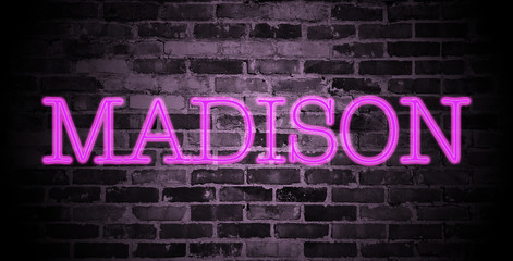 Fototapeta na wymiar first name Madison in pink neon on brick wall