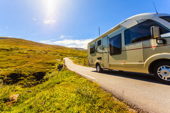 Camper Car On Road In Orwegian Mountains