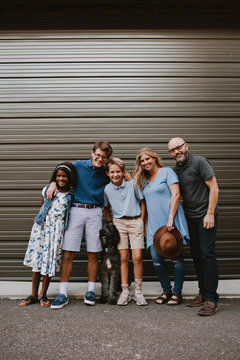 Multi-Race Family and their Dog in an Urban Setting