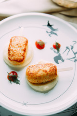 Chicken and cheese nuggets with sauce. Restaurant dishes with a beautiful serving.