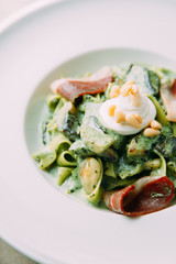 Pasta with cream sauce and shrimp. Restaurant dishes with a beautiful serving.