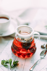 Fruit tea in a teapot with decor. Restaurant dishes with a beautiful serving.