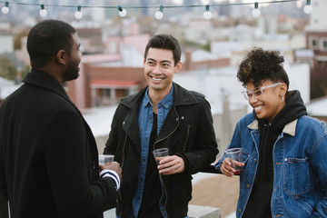 Friends hanging out on rooftop 