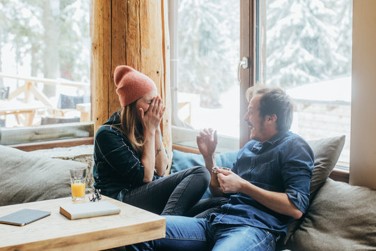 Fototapeta Couple Enjoying Winter Vacation in Mountain