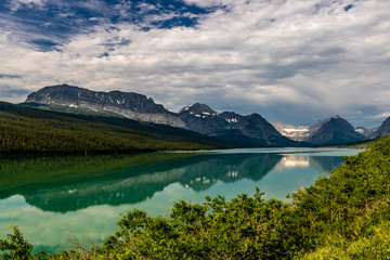 Reflections of the many glaciers in Swift current Lake, Many Glaciers, Glacier National Park, Montana, United States