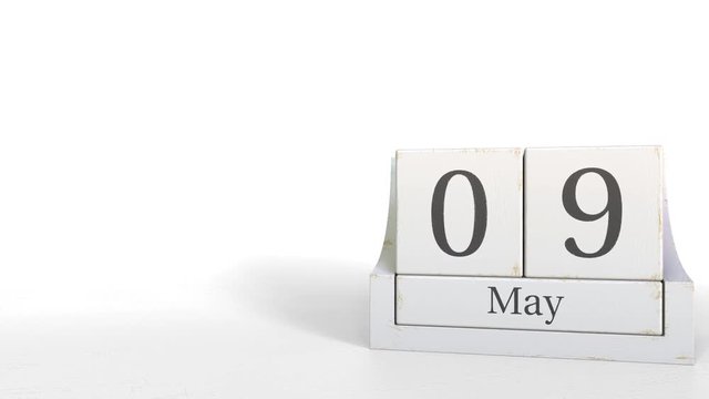 Cube calendar shows May 9 date. 3D animation