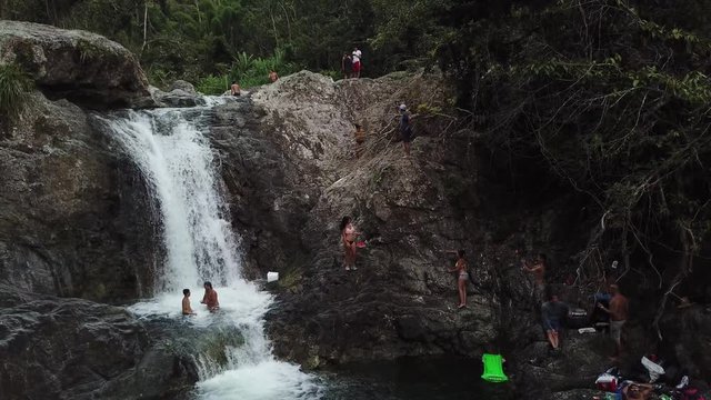 Pulling back and down over El Ataud Waterfall to reveal more of the natural structure.