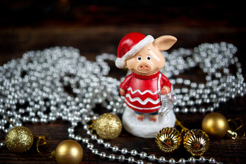 Christmas card with a pig and Christmas decorations. Year of pig.