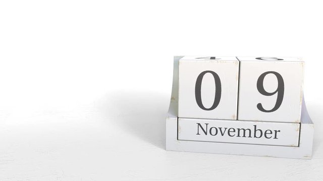 Cube calendar shows November 9 date. 3D animation