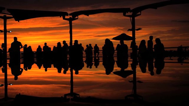 Sunset over Lima city coastline Larcomar Shopping Mall Miraflores district a tourist travel destination Peru South America