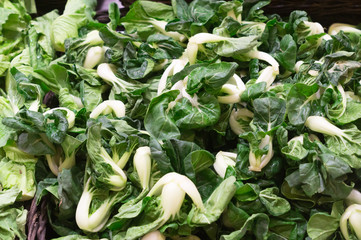 Fresh Chinese mustard in a basket on sale in supermarket