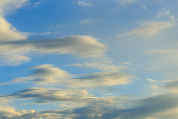Clouds after rain before sunset as a background