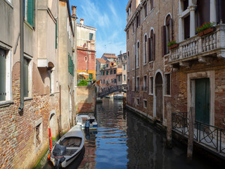Fototapeta na wymiar Venice, Italy. Wonderful views through the narrow canals of the town