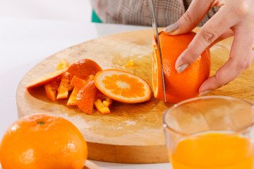 girl is learning to make fruit juicc