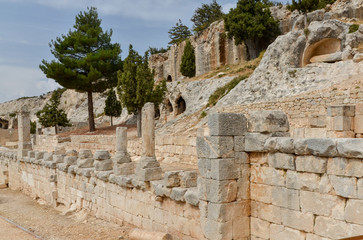 Obraz premium Colonnaded Walkway and cave dwellings in Alahan Monastery in the mountains of Isauria Mut, Mersin province, Turkey