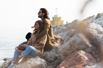 Beautiful couple outdoors by the sea
