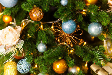Christmas tree and Christmas decorations in yellow and blue colors