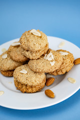 Gluten-Free Cookies almond with almond slice in white plate.