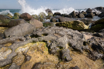 Waves smaching into the rocky shore of Stenvs Klint Denmark