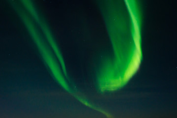 Beautiful stripes of the northern lights, aurora in the night sky.