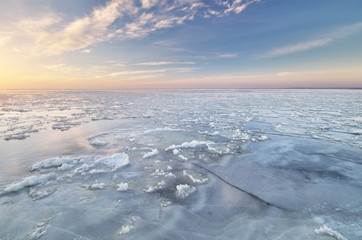 Winter landscape. Ice on water.