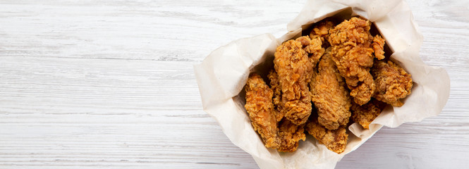 Tasty chicken wings, overhead view. Top view, from above. Copy space.