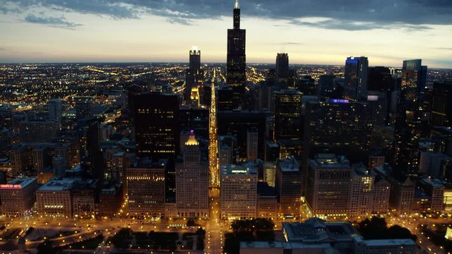 Aerial sunset view of Chicago city road traffic and skyscrapers