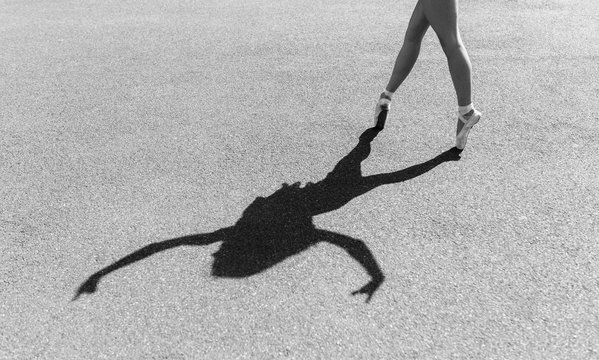 Graceful dancer jumping on street