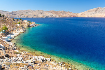 Naklejka na ściany i meble view on beautiful coast on Symi island in Greece