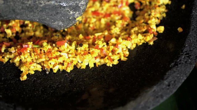 Basa gede made by hand with selection of Asian spices crushed using traditional pestle and mortar 