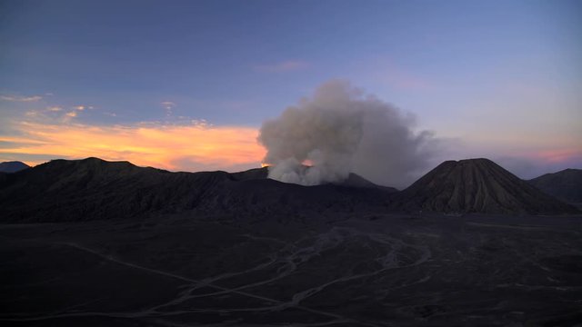 River Delta mud flows at sunrise Mt Bromo volcano erupting Java 