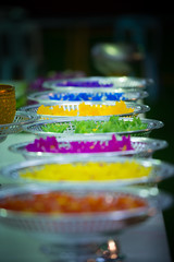 Platters with Colorful Lotos Floating Flower Candles Vertical Composition