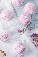  fruit marshmallow homemade on a soft pink background and dried flowers