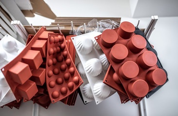 A silicone and steel molds on a white background