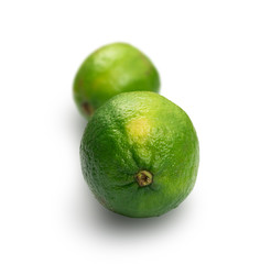 Sour key one whole lime isolated on white background
