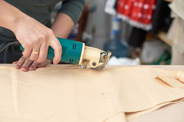 Woman cuts napkins special machine.