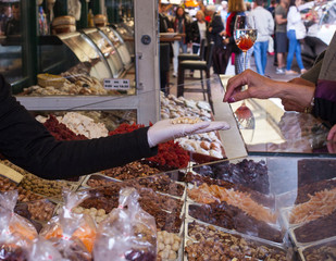 Street vendor let it taste nuts to tourist