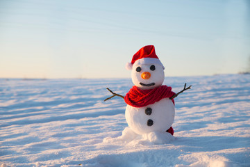 snowman on orange sunset background christmas santa