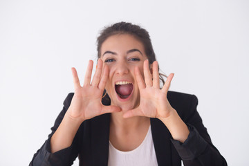 Female young buyer shocked from sale and shouting. Portrait of excited girl in black jacket yelling at camera. Isolated on white. Shocking news concept