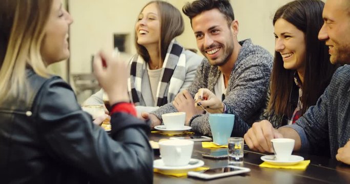 large group of friends in an outdoor cafeteria