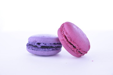 Violet and pink macaroon on a white background, dessert