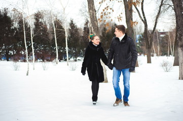 Fototapeta na wymiar couple in love in the winter forest